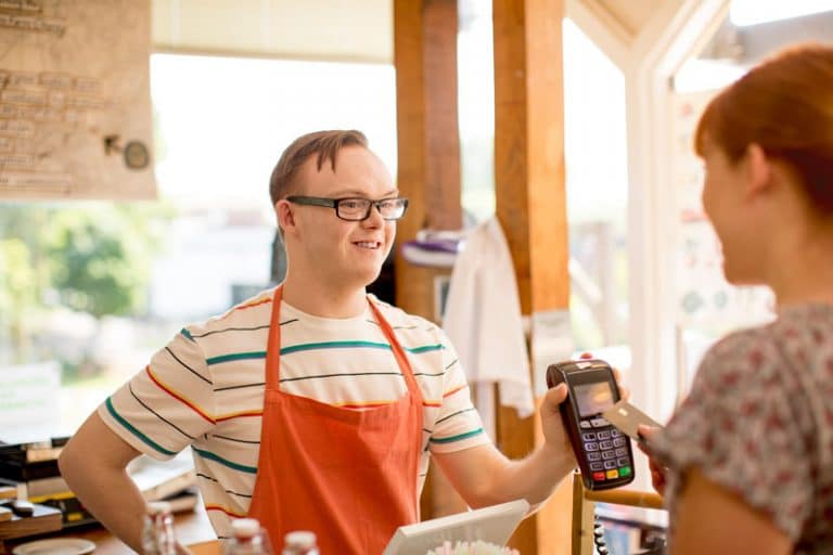 down syndrome worker at cafe